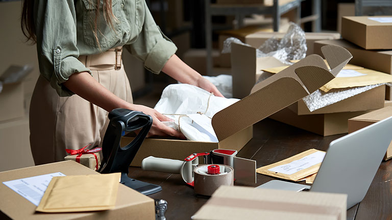 Small Business Owner Packing Box Fulfill eCommerce order
