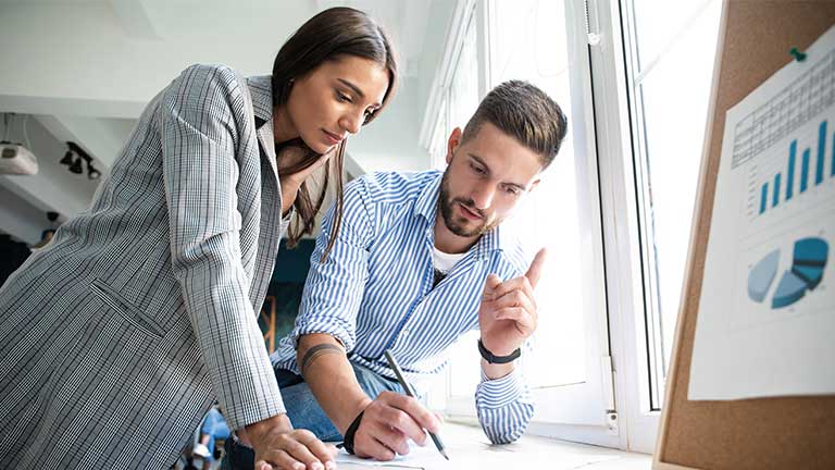 Coworkers collaborating in modern office