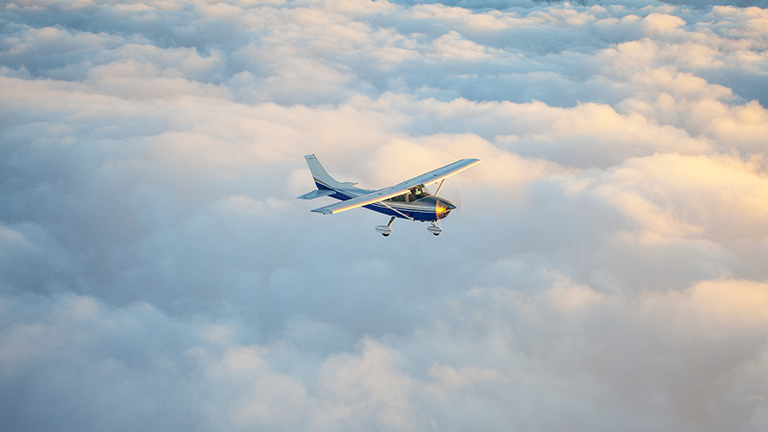 plane flying in the clouds in Canada